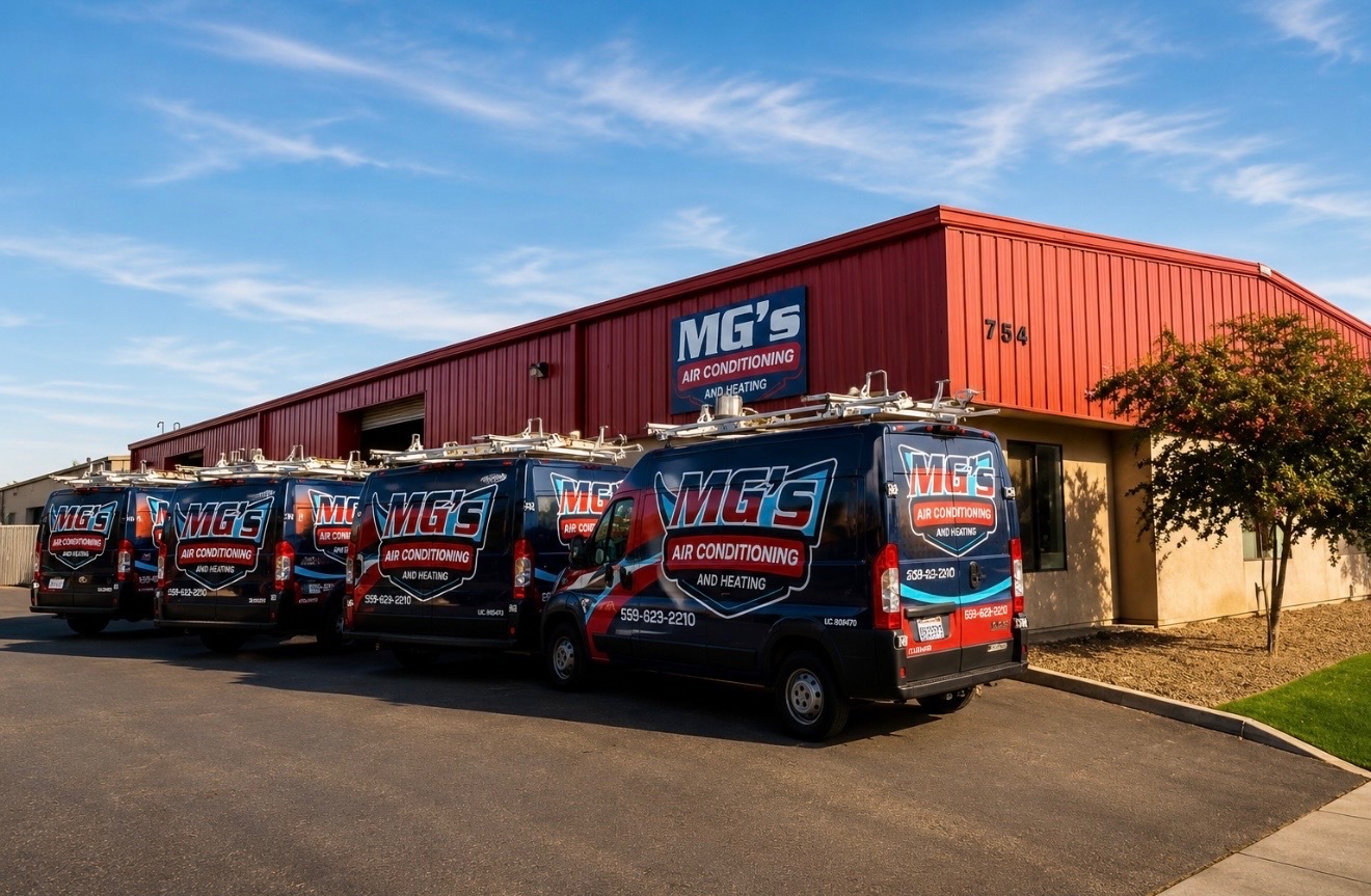 MG's Air Conditioning & Heating service van fleet parked outside their Visalia shop